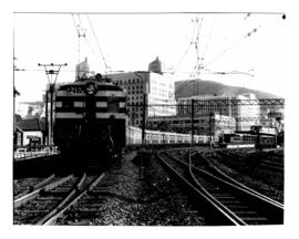 Cape Town, 1961. New electric motor coach train leaving Cape Town railway station on the way to S...