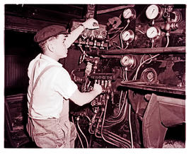Springs, 1966. SAR. Learner fireman at locomotive depot.