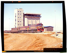 Bapsfontein, August 1982. Goods train before control tower at Sentrarand. [T Robberts]