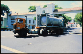 Durban, 1987. Road truck towing containerised tank at Bayhead.