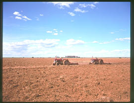 Rustenburg district, 1975. Two tractors ploughing.
