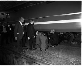 May 1972. Visit by university professors to SAR Electrical Department, inspecting the underside o...