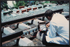 
Making measurements at experimental track section.
