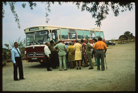 SAR Mercedes Benz tour bus No MT60055 with passengers at roadside stop.