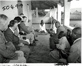 Tzaneen district, 1946. Queen Modjadji in audience with botanists.