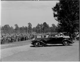 Pretoria, 1 April 1947. Royal family in Daimler with large crowd in waiting.