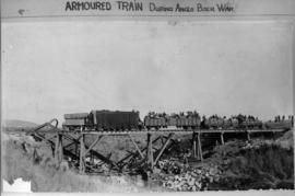 Armoured train on temporary trestle bridge during Boer War.