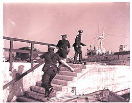 Durban, July 1974. Water police charging up steps in Durban Harbour.