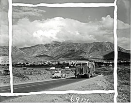 Montagu district, 1960. SAR Thornycroft three-axle combination bus and truck with town in the dis...