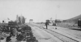 Deelfontein, 1895. Man posing at loading platform. (EH Short)