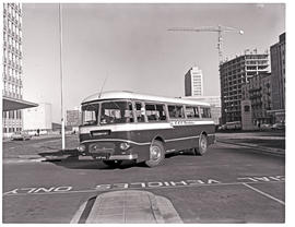Johannesburg, 1966. SAR Leyland Royal Tiger motor coach No MT16308 with Paul Kruger building on t...