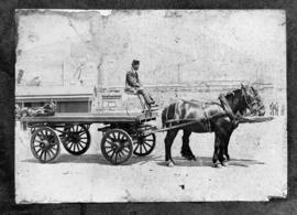 Trailer drawn by two horses.