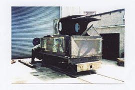 Old abandoned locomotive at modern workshop.