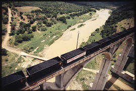 Ulundi district. Coal train crossing the single-track White Mfolozi bridge on the Richards Bay co...