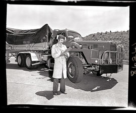 
Driver standing next to SAR International Harvester truck.

