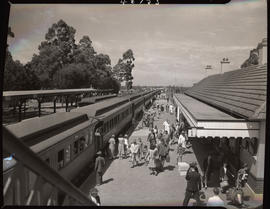 George, 1942. Passenger train at station platform.