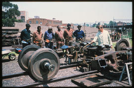 Johannesburg, September 1974. Instruction given to workers on railway bogies in Germiston. [V Gil...