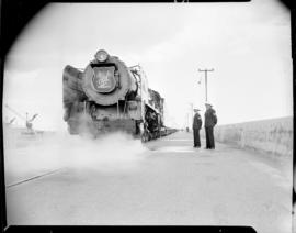 Cape Town, 1947. SAR Class 15F No 3030 with Royal Train in readiness on the Eastern Mole in harbour.