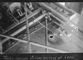 Circa 1925.  Damage due to trolley hanger falling on the roof of electrical locomotive. (Album on...