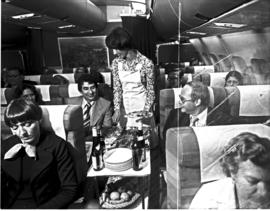 
Cabin service in SAA Airbus A300, hostess serving drinks.
