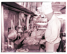 
Chef at work in kitchen of SAR dining car.
