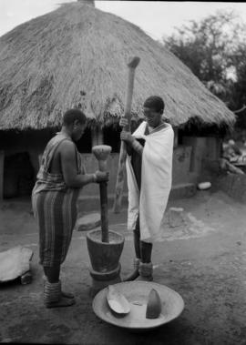Northern Transvaal, 1934. Bavenda girls stamping mealies.