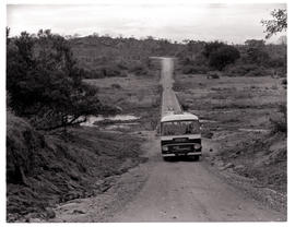 Kruger National Park, 1966. SAR Leyland Royal Tiger motor coach No MT16306 after crossing causeway.