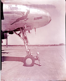 SAA Lockheed Constellation ZS-DBU 'Durban' with little boy at nosewheel.
