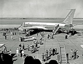 
SAA Boeing 707 ZS-CKD 'Kaapstad'. Passengers disembarking. Note film camera on the roof of the F...