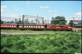 Johannesburg, 1979. SAR Class 6EI with passenger train at Mayfair.