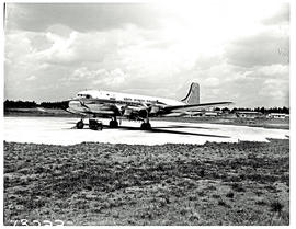 Durban, 1963. Louis Botha airport. SAA Douglas DC-4 ZS-AUB 'Outeniqua' parked at airport.