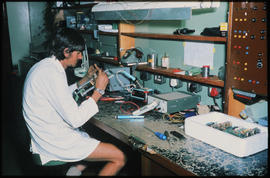 Vryheid, 1980. Signal technician testing equipment in centralised traffic control centre.