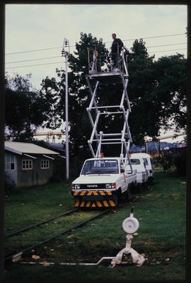Pretoria, March 1990. SAR Transpect MK-1 rail vehicle at Koedoespoort with extended scissors hois...