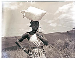 Natal South Coast, 1952. Zulu woman with bag on head.
