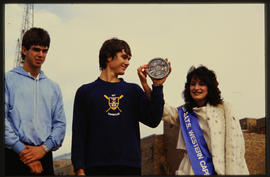 Cape Town, 1985. UCT rowing club accepting medal from Miss Western Cape during 1910-1985 festivit...