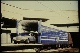 Motor car leaving Blue Train from SAR type SCL-5 car transport wagon.