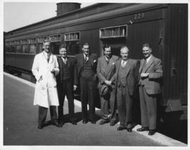 Mr CT Long, third from left, outside SAS dining car type A-28 No 229 'Shashi' with other SAR offi...