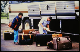Loading luggage into SAR tour bus.