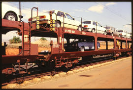 Ford Motor car load on SAR type SCL-4 motor car wagons.