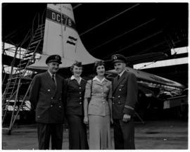February 1958. SAA Douglas DC-7B ZS-DKE 'Reiger' with crew. pilot, hostess.
