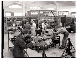 "Johannesburg, 1962. Engine assembly in SAR Road Transport Services workshops at Langlaagte....