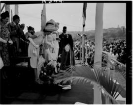 Durban, 22 March 1947. Princess Elizabeth receiving flowers from young Indian girl at Curries Fou...