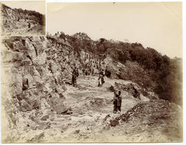 Workers at rock cutting under construction. Caption "Kilo 168'.