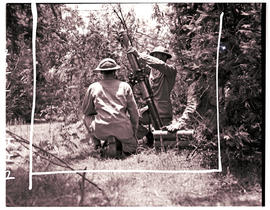 
Army recruits in training, mortar training.
