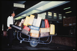 
Railway porter handling luggage.
