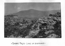 Sabie district, 1914. Sabie River waterfall with railway line in the distance. (Dempster Album of...
