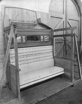 Mockup of NGR triple sleeping bunk, beds folded up.