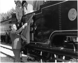 Dave Parsons and driver looking on unveiling nameplate of Kitson locomotive No 13 ex SAR Class C.