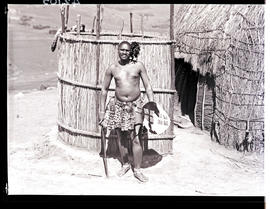 Zululand, 1933. Man posing at hut.