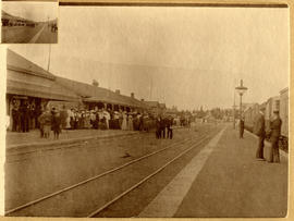 Large crowd at railway station.